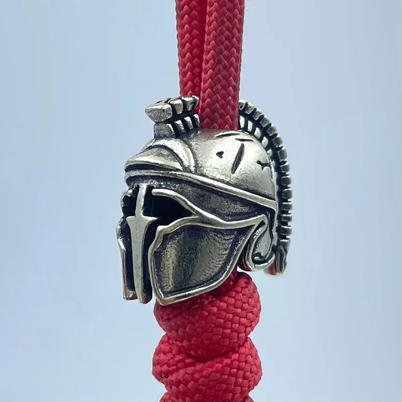 Perle casque spartiate pour paracorde – finition métal antique