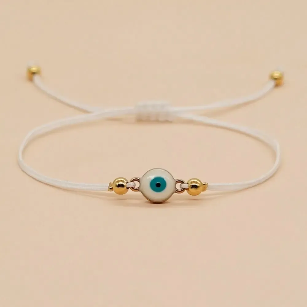 Bracelet œil grec bleu – cordon blanc porte-bonheur