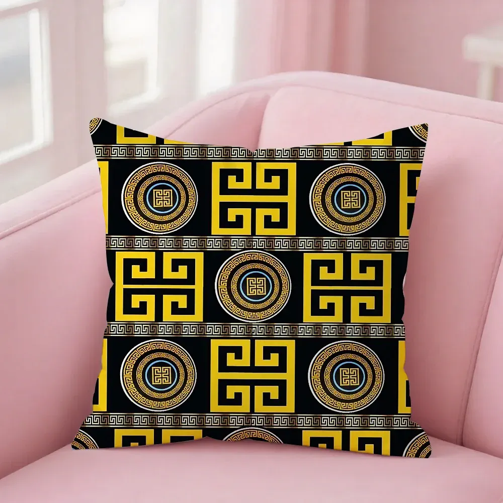 Housse de coussin grecque noire et jaune – motifs géométriques
